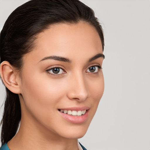 Joyful white young-adult female with long  brown hair and brown eyes