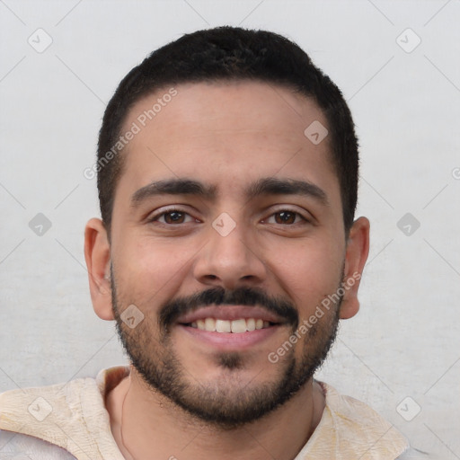 Joyful white young-adult male with short  black hair and brown eyes