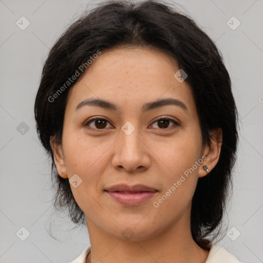 Joyful latino young-adult female with medium  brown hair and brown eyes