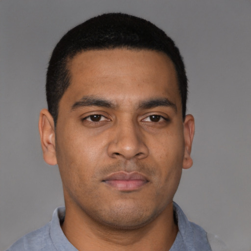 Neutral latino young-adult male with short  brown hair and brown eyes