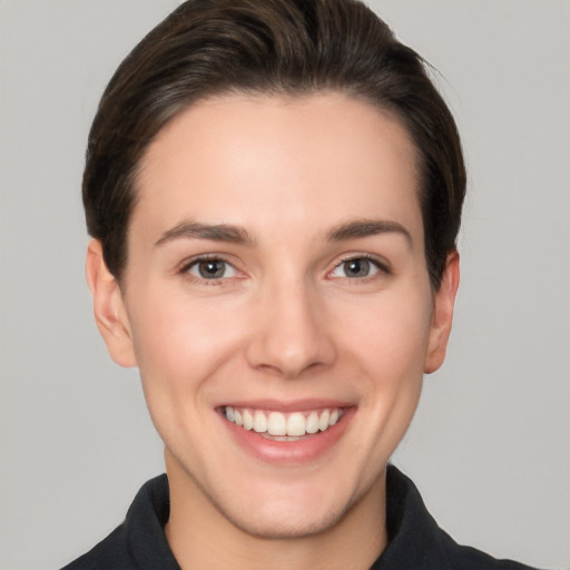 Joyful white young-adult female with short  brown hair and brown eyes