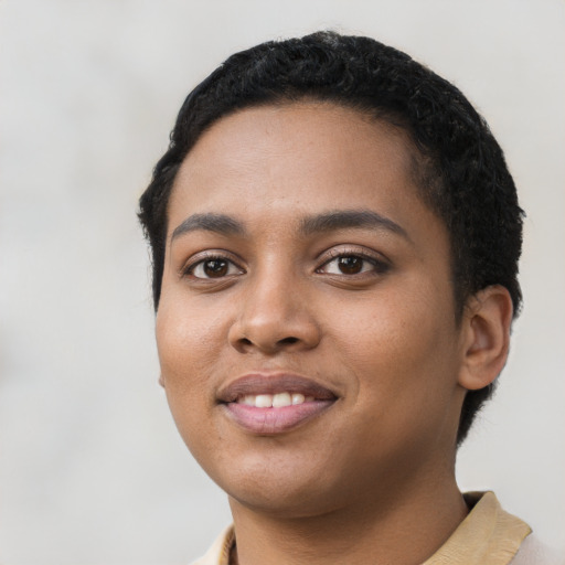 Joyful latino young-adult female with short  black hair and brown eyes