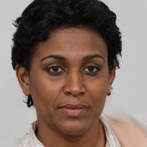 Neutral black adult female with short  brown hair and brown eyes