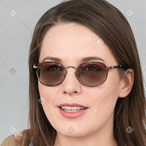 Joyful white young-adult female with long  brown hair and blue eyes