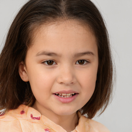 Joyful white child female with medium  brown hair and brown eyes