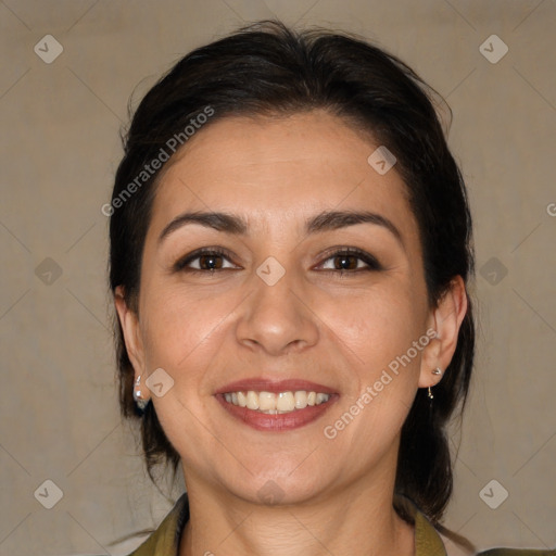 Joyful white adult female with medium  brown hair and brown eyes