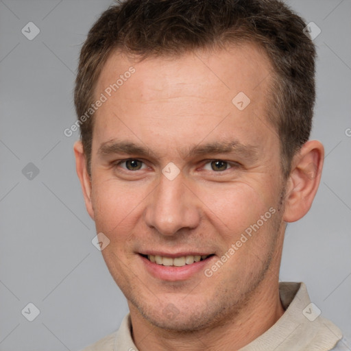 Joyful white adult male with short  brown hair and brown eyes