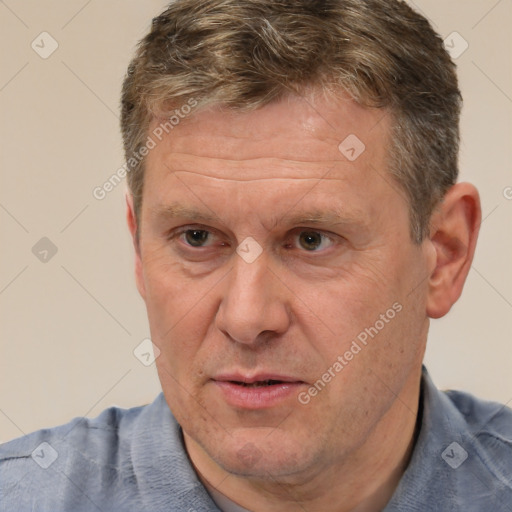 Joyful white middle-aged male with short  brown hair and brown eyes