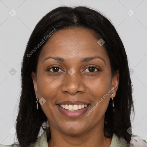 Joyful black young-adult female with long  black hair and brown eyes