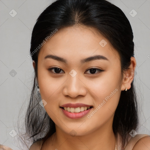 Joyful asian young-adult female with medium  brown hair and brown eyes