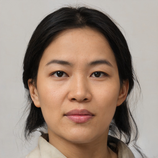 Neutral asian young-adult female with medium  brown hair and brown eyes