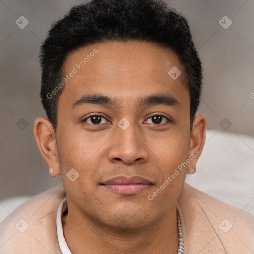 Joyful latino young-adult male with short  brown hair and brown eyes