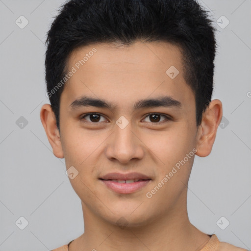 Joyful latino young-adult male with short  brown hair and brown eyes