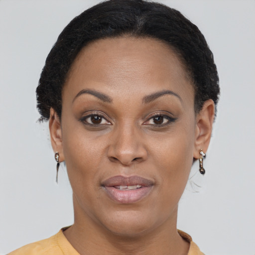 Joyful latino young-adult female with short  brown hair and brown eyes