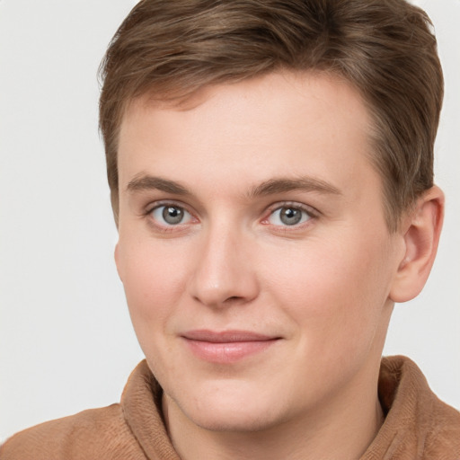 Joyful white young-adult female with short  brown hair and grey eyes