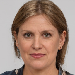 Joyful white adult female with medium  brown hair and grey eyes