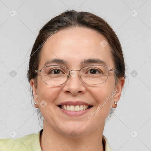 Joyful white adult female with short  brown hair and brown eyes