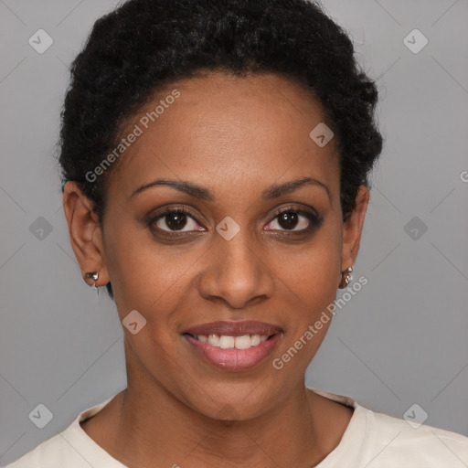 Joyful black young-adult female with short  brown hair and brown eyes