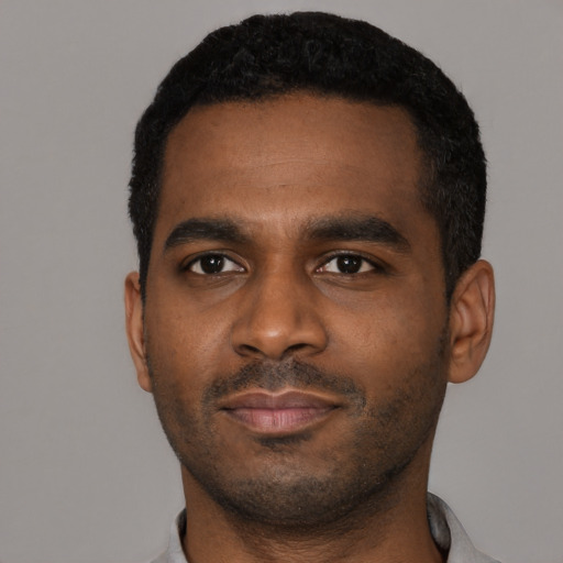 Neutral black young-adult male with short  black hair and brown eyes