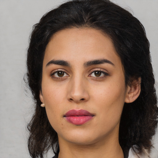 Neutral latino young-adult female with medium  brown hair and brown eyes