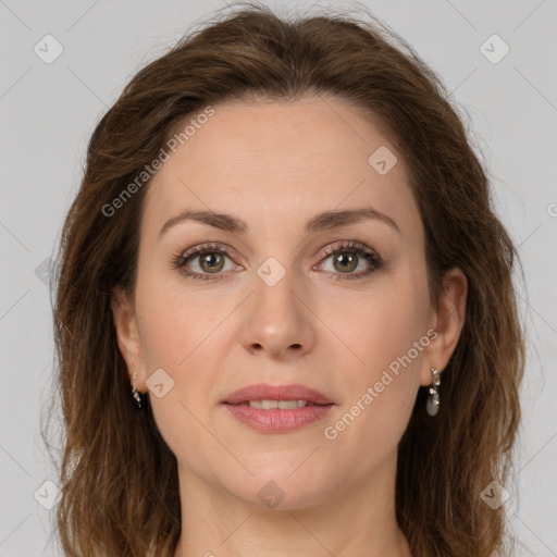 Joyful white young-adult female with long  brown hair and green eyes