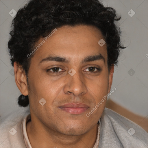 Joyful latino adult male with short  brown hair and brown eyes