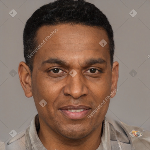 Joyful latino adult male with short  brown hair and brown eyes