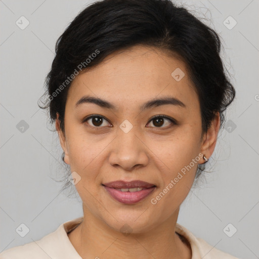 Joyful latino young-adult female with medium  brown hair and brown eyes