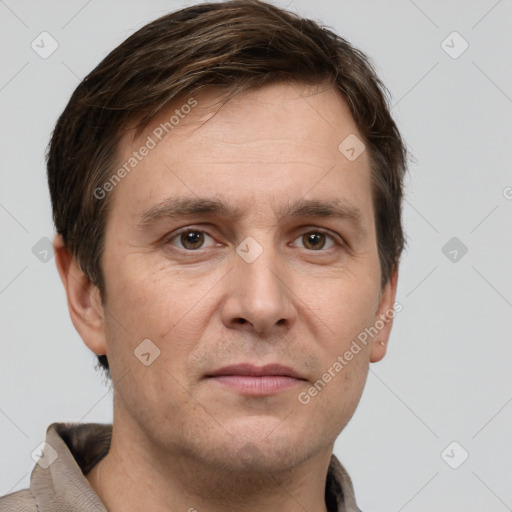 Joyful white adult male with short  brown hair and grey eyes