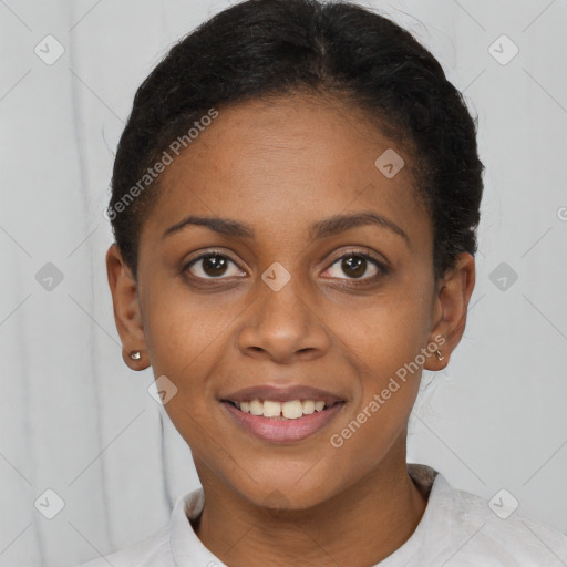 Joyful black young-adult female with short  brown hair and brown eyes