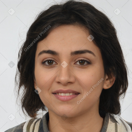 Joyful latino young-adult female with medium  brown hair and brown eyes