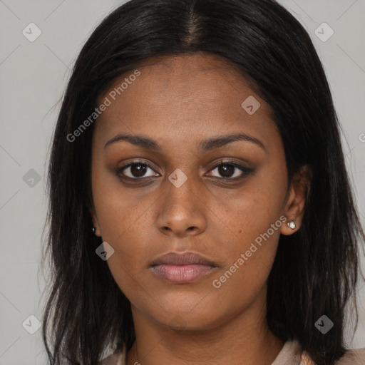 Neutral black young-adult female with long  brown hair and brown eyes