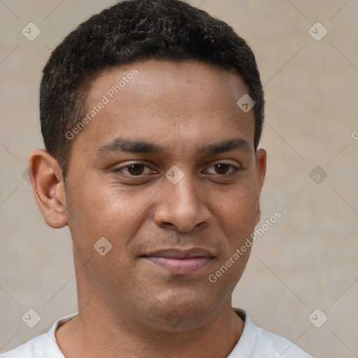 Joyful latino young-adult male with short  brown hair and brown eyes