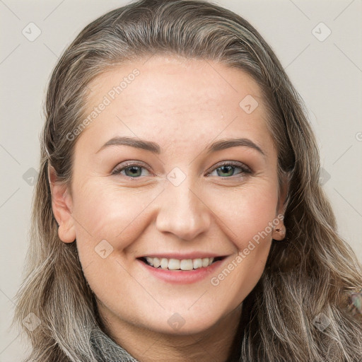 Joyful white young-adult female with long  brown hair and grey eyes