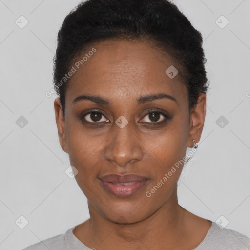 Joyful black young-adult female with short  black hair and brown eyes