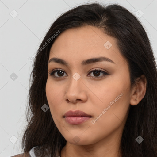 Joyful latino young-adult female with long  brown hair and brown eyes