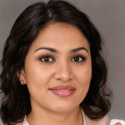 Joyful white young-adult female with medium  brown hair and brown eyes