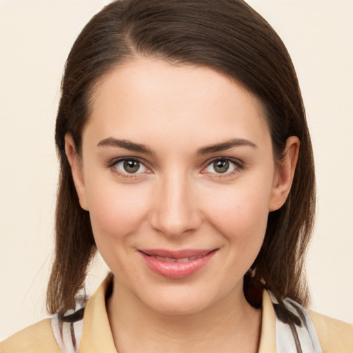 Joyful white young-adult female with medium  brown hair and brown eyes