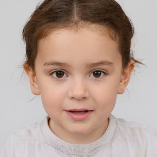 Joyful white child female with short  brown hair and brown eyes