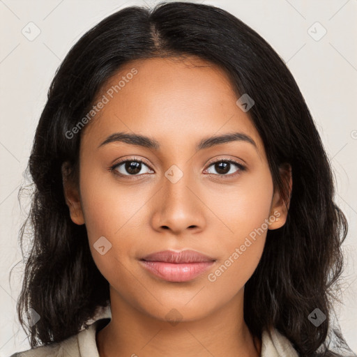 Joyful latino young-adult female with long  brown hair and brown eyes