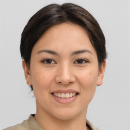 Joyful asian young-adult female with short  brown hair and brown eyes