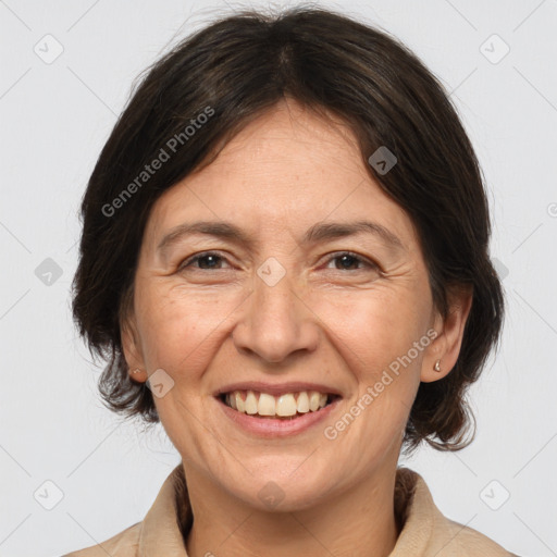 Joyful white adult female with medium  brown hair and brown eyes