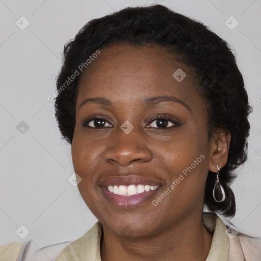 Joyful black young-adult female with medium  black hair and brown eyes