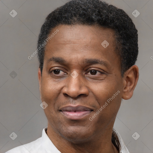 Joyful latino adult male with short  black hair and brown eyes