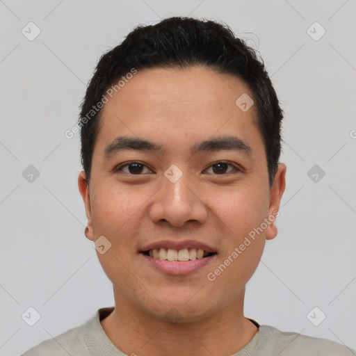 Joyful asian young-adult male with short  black hair and brown eyes