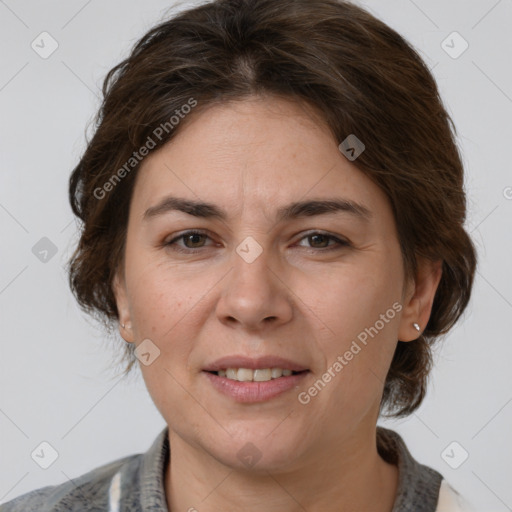 Joyful white adult female with medium  brown hair and grey eyes