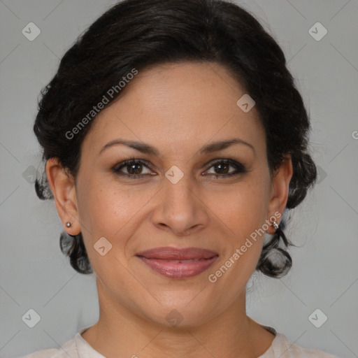 Joyful latino adult female with medium  brown hair and brown eyes