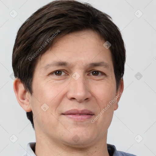 Joyful white adult male with short  brown hair and brown eyes