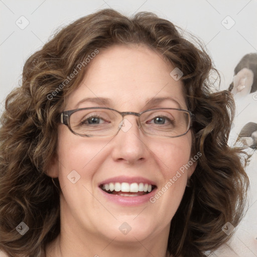 Joyful white adult female with medium  brown hair and blue eyes