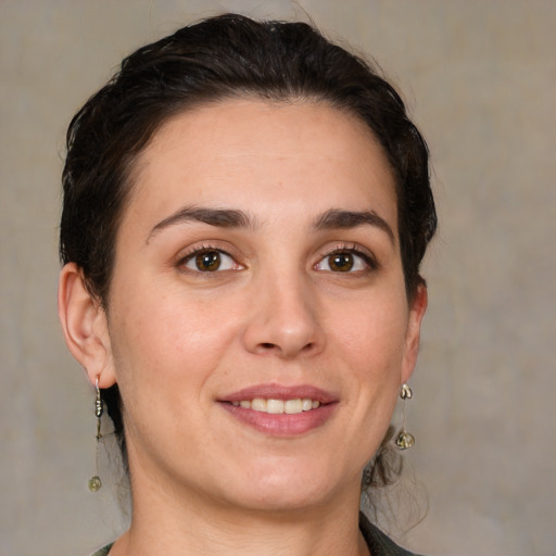 Joyful white young-adult female with medium  brown hair and brown eyes